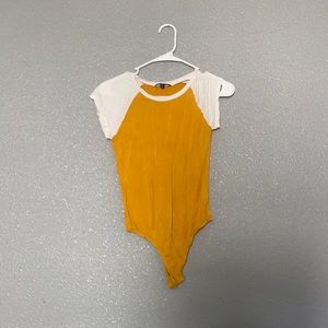 Yellow and white body suit